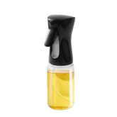 Oil Spray Bottle(220ML) with a sleek black nozzle and transparent body filled with oil.